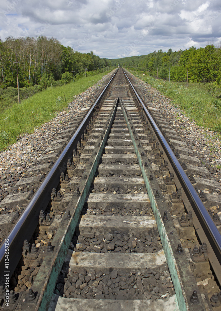 View of empty railroad track. Perspective view. Vertical composition of railway.