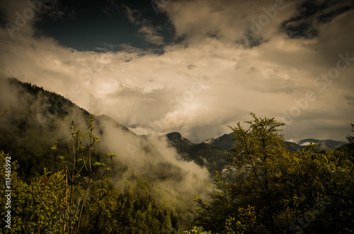 Mountains and clouds in the rainforest. Dramatic clouds with mountain and tree in the morning shot.