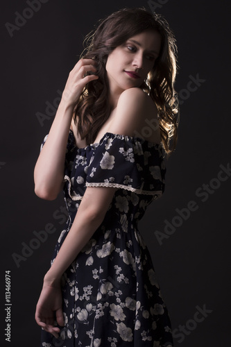 Tender woman posing in the shadows