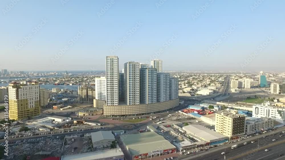 Cityscape of Ajman with modern buildings aerial top view Cityscape of Ajman with modern buildings aerial top view