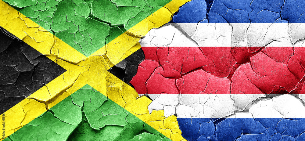 Jamaica flag with Costa Rica flag on a grunge cracked wall