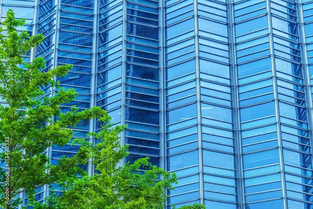 modern office building with green trees modern office building with green trees