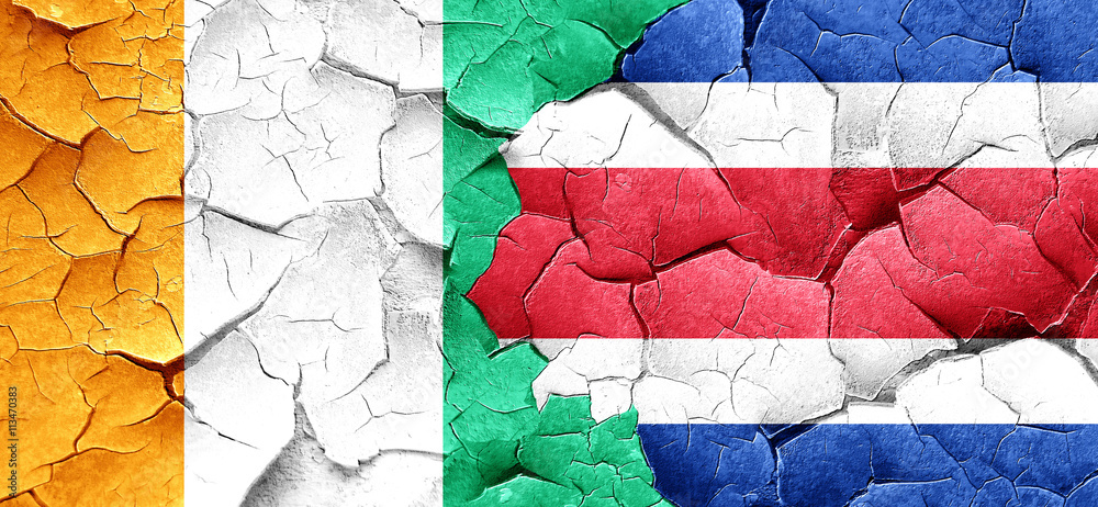 Ivory coast flag with Costa Rica flag on a grunge cracked wall