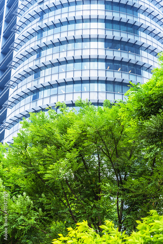 modern office building with green trees