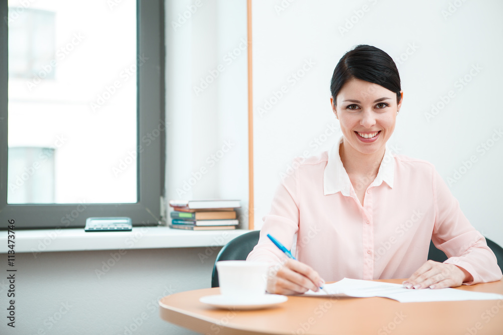 wonam work with papers in office room. wonam work with papers in office room.