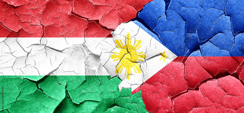 Hungary flag with Philippines flag on a grunge cracked wall