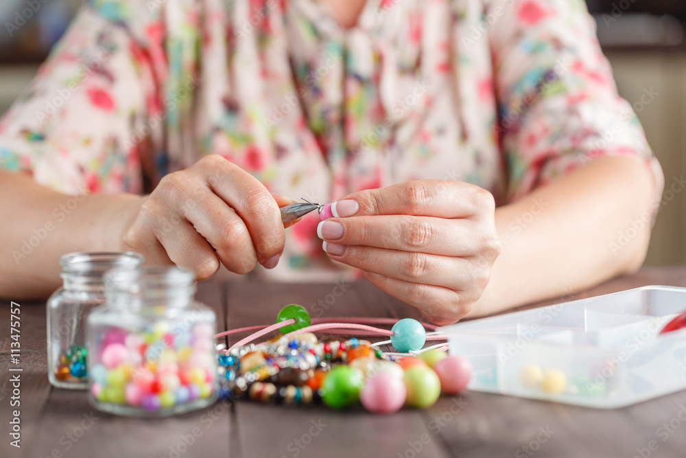 Woman making home craft art bijouterie Woman making home craft art bijouterie