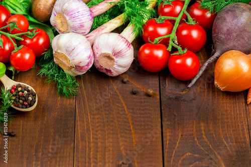 Beautiful background healthy organic eating. Studio photography of different vegetables and mushrooms on the old brown boards with free space