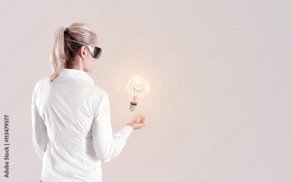 Woman in virtual reality glasses looking to the hologram, isolated, clipping path. Shirt person stand back looking 3d cyber headset display. Wearable vr computer head set goggles watching. Man glasses