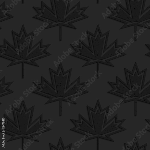 Black textured plastic maple leaves countered with inside