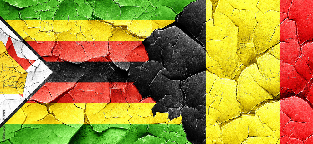 Zimbabwe flag with Belgium flag on a grunge cracked wall