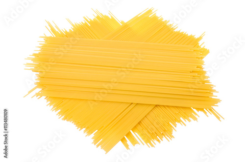 Unprepared uncooked long pasta spaghetti isolated on white background