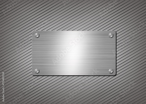 shiny metal plate on gray background