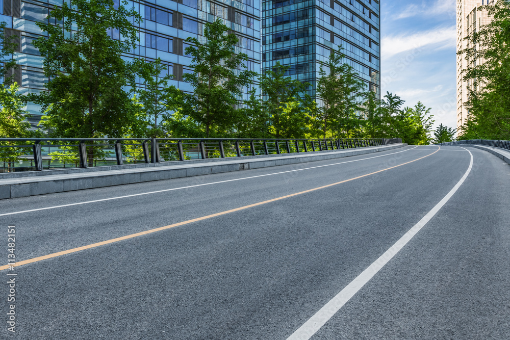 clean road with modern glass buildings background