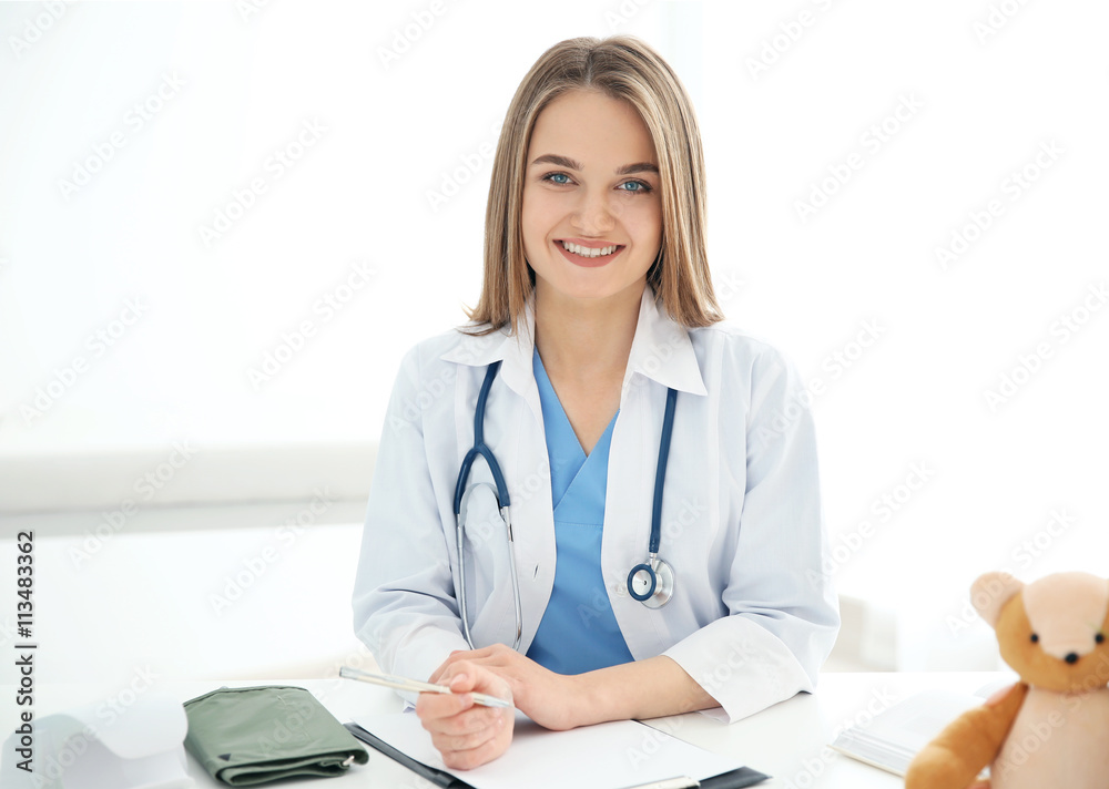 Young beautiful female doctor working at the office Young beautiful female doctor working at the office