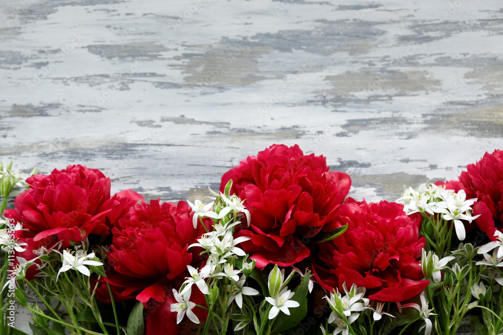 Beautiful fresh bouquet on wooden background Beautiful fresh bouquet on wooden background