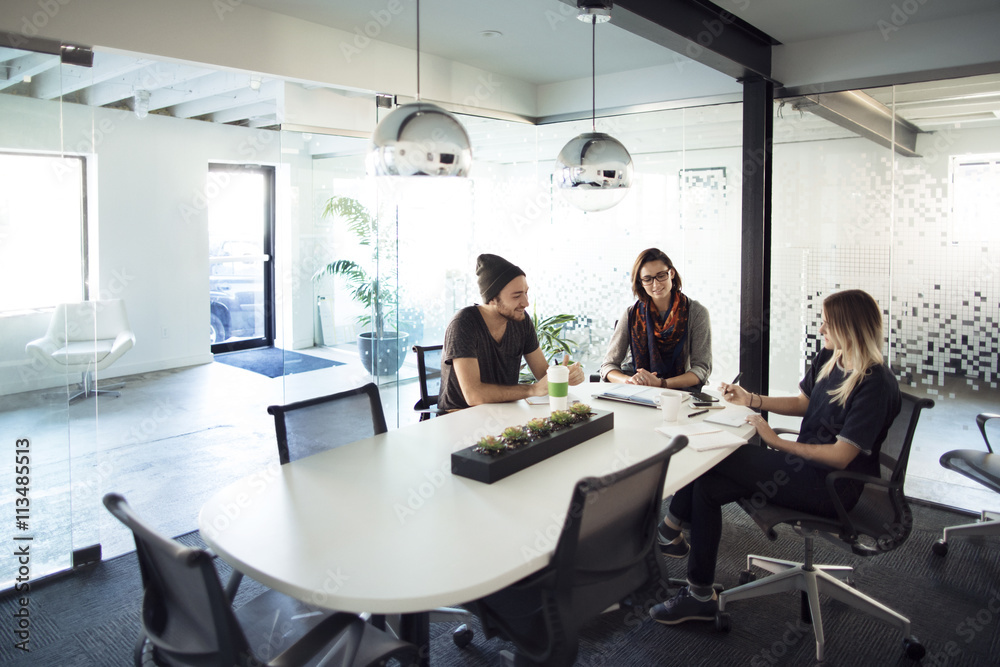 Colleague talking with each other in conference room Colleague talking with each other in conference room