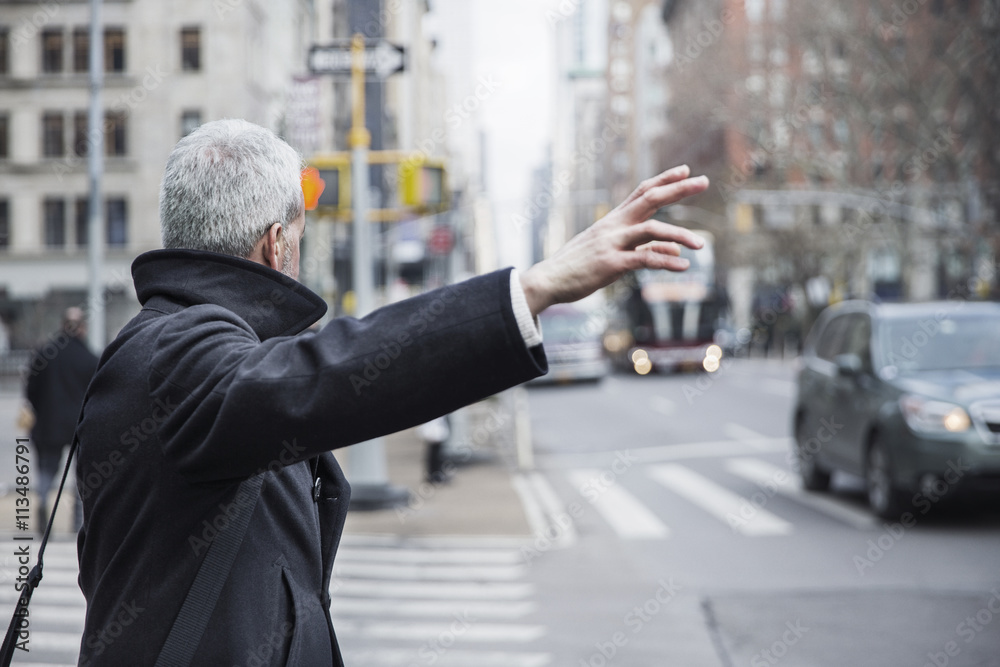 Man stopping taxi cab on street Man stopping taxi cab on street