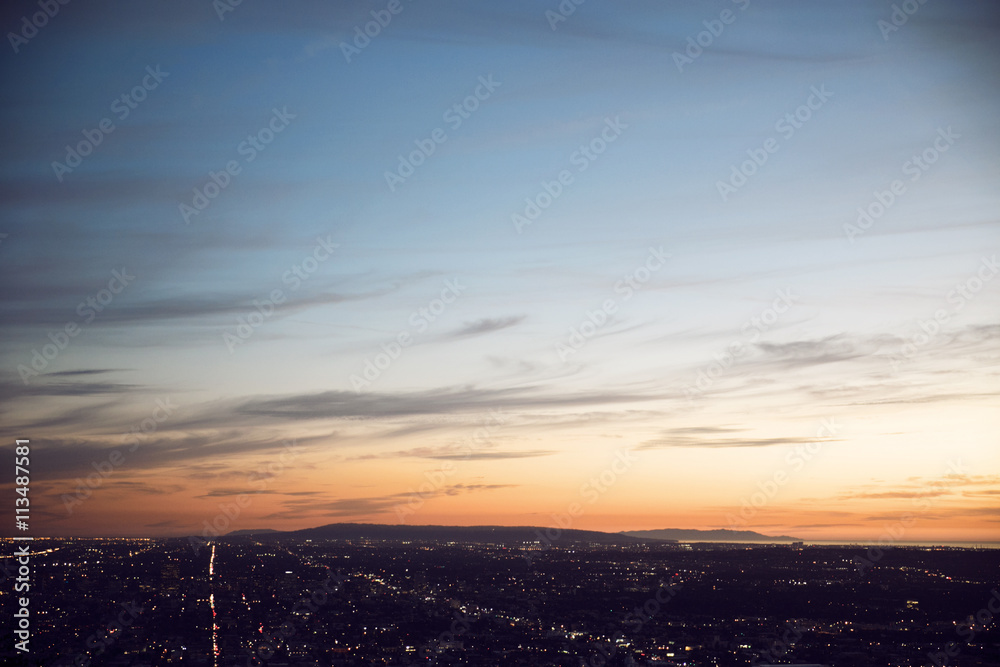 Aerial view of cityscape against sky during sunset Aerial view of cityscape against sky during sunset