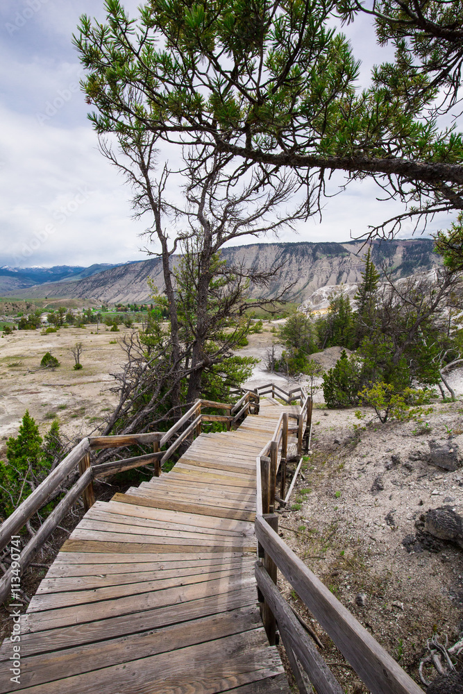 Fototapeta premium Beautiful cinematic view of nature landscape in the American West under the blue cloudy sky. Geyser.