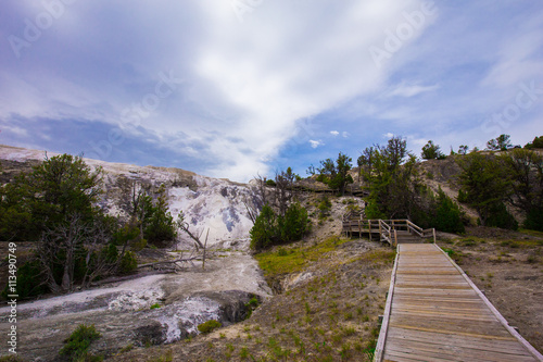 Beautiful cinematic view of nature landscape in the American West under the blue cloudy sky. Geyser.