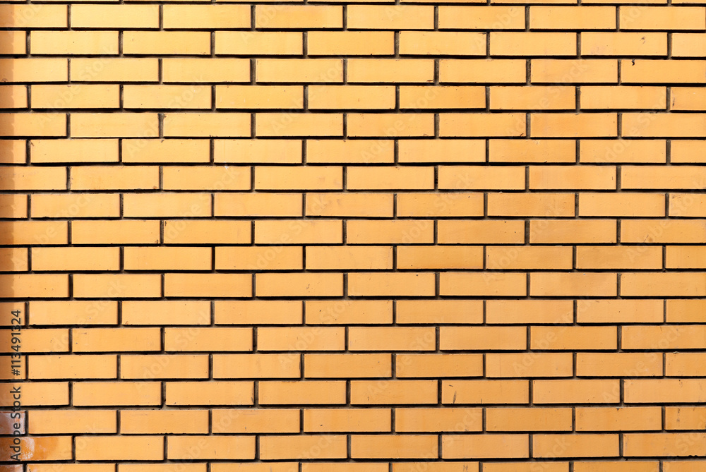 Yellow brick wall background Yellow brick wall background