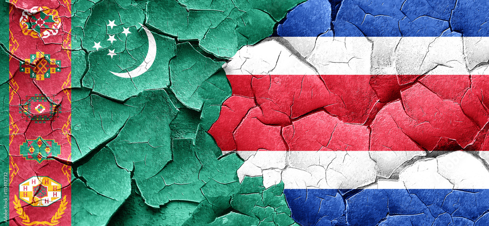Turkmenistan flag with Costa Rica flag on a grunge cracked wall
