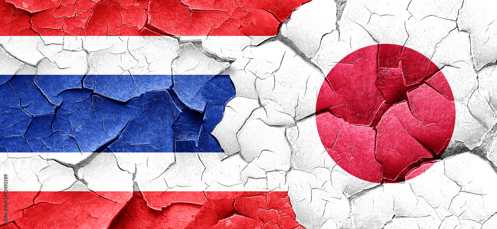 Thailand flag with Japan flag on a grunge cracked wall Thailand flag with Japan flag on a grunge cracked wall