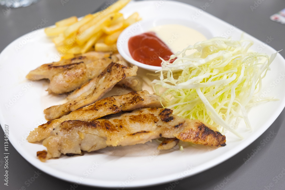 steak with french fries and salad