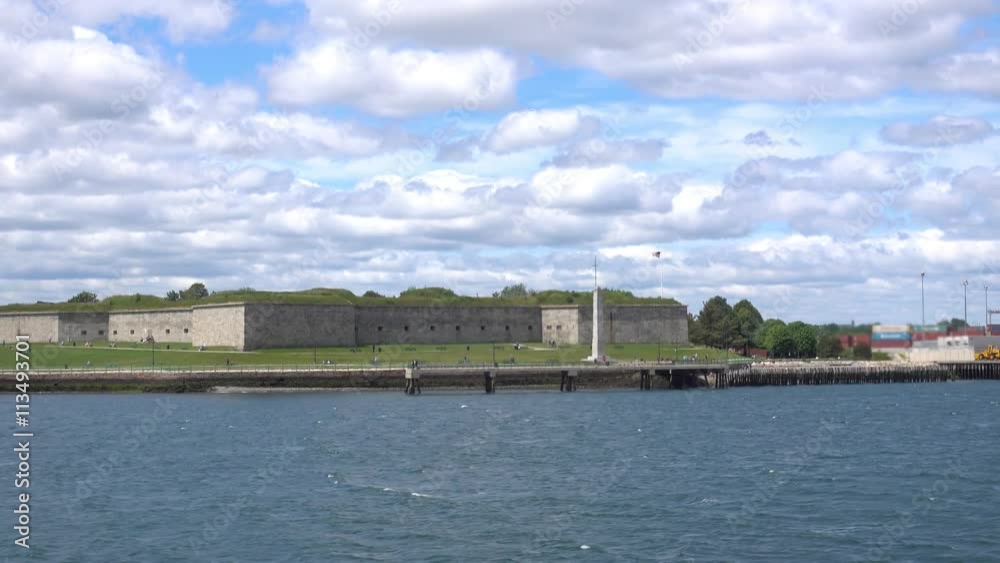 A daytime establishing shot of Castle Island Park in Boston as seen from the harbor. A daytime establishing shot of Castle Island Park in Boston as seen from the harbor.