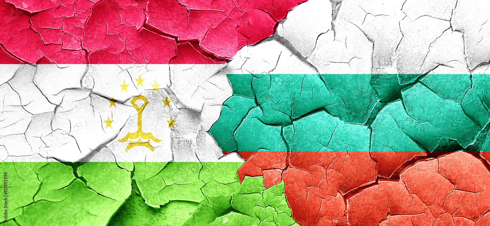Tajikistan flag with Bulgaria flag on a grunge cracked wall