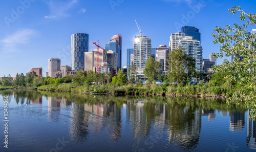 Calgary skyline reflected in a reconstructed urban wetland along the Bow River.