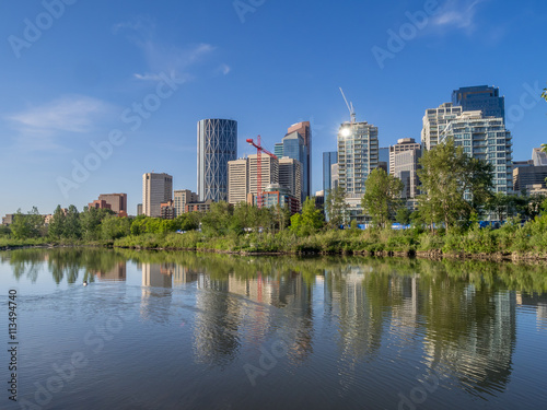 Calgary skyline reflected in a reconstructed urban wetland along the Bow River.
