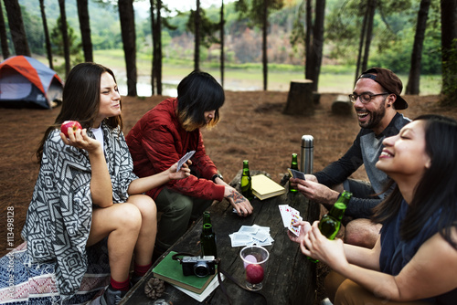 Group of Friends Hanging Playing Cards Together Concept