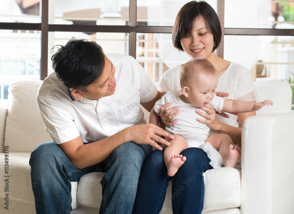 Happy Asian Family Playing with baby in the living room Happy Asian Family Playing with baby in the living room