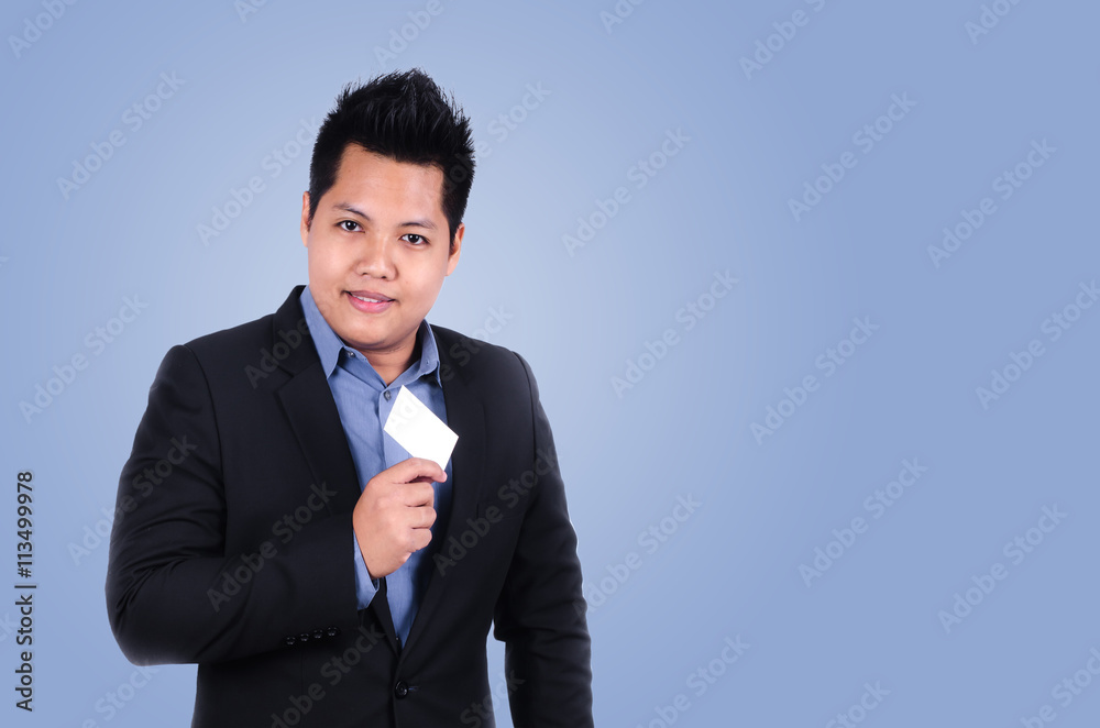 Happy businessman holding name card with purple colour pantone t Happy businessman holding name card with purple colour pantone t