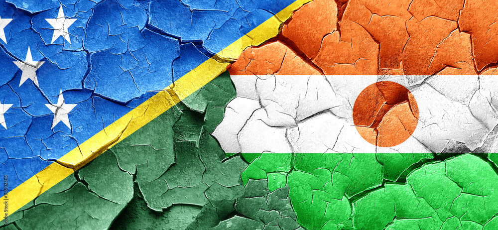 Solomon islands flag with Niger flag on a grunge cracked wall