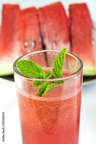 Close-up of fresh watermelon juice isolated on white background