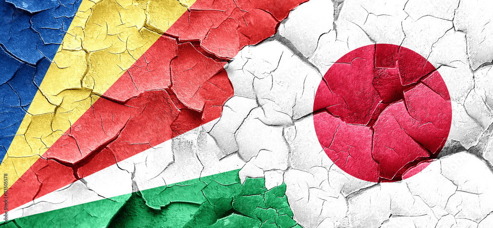 seychelles flag with Japan flag on a grunge cracked wall