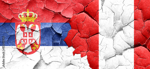 Serbia flag with Peru flag on a grunge cracked wall