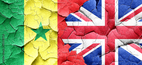 Senegal flag with Great Britain flag on a grunge cracked wall
