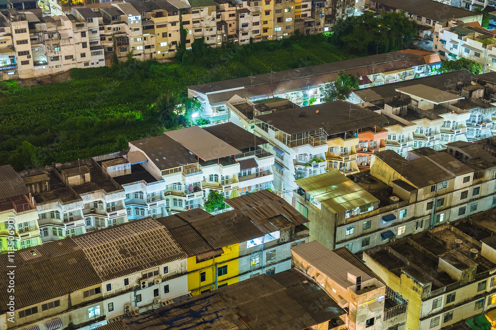 Fototapeta premium House village warren crowded light neon in capital at night scene