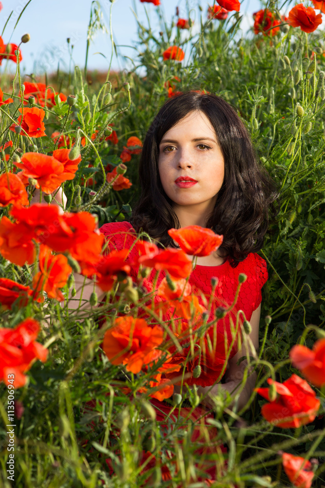 Girl in a field of poppies