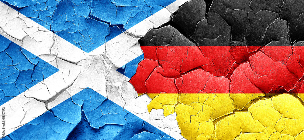 scotland flag with Germany flag on a grunge cracked wall