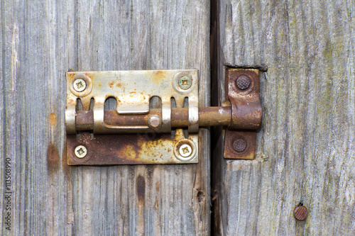 Steel lock of iron corroded by rust. Very old. Strong influence