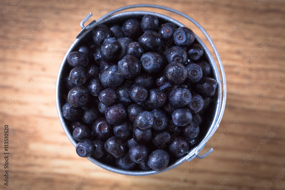 Blueberry on wooden table background. Ripe and juicy fresh picke Blueberry on wooden table background. Ripe and juicy fresh picke