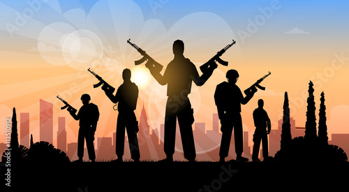 Silhouette of man holding rifle, city in background