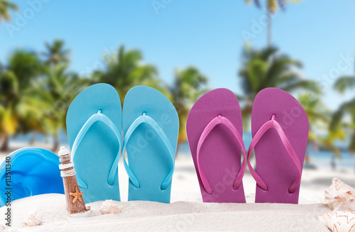 Summer concept, flip-flops, summer accessories on summer beach background