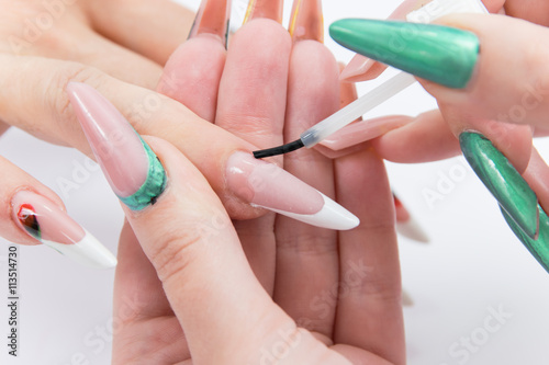process of manicure at beauty salon
