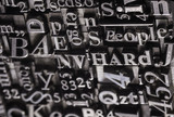 Metal Letterpress Types.
A background from many historic typographical letters in black and white with white background.
